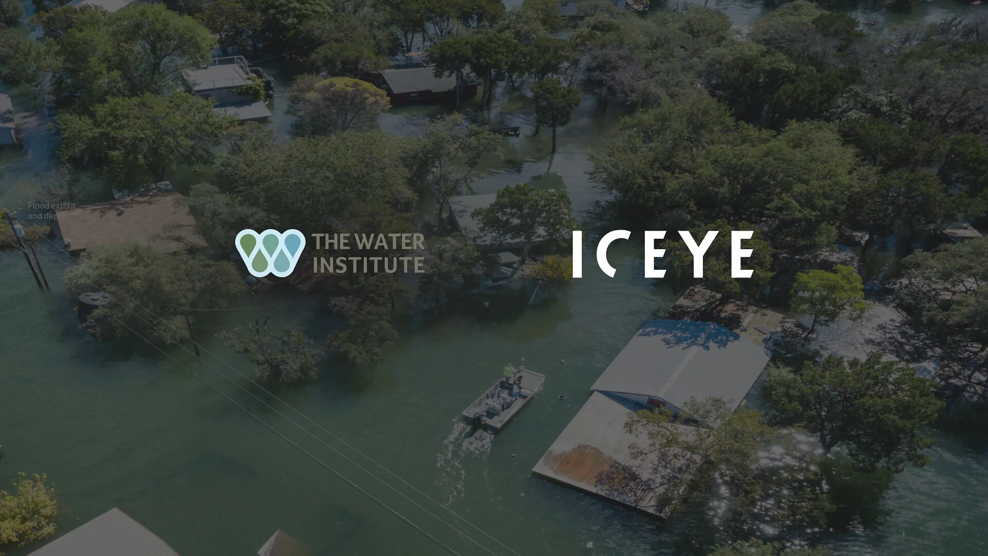 Flooded neighborhood with trees, submerged homes and a boat, overlaid with The Water Institute and ICEYE logos
