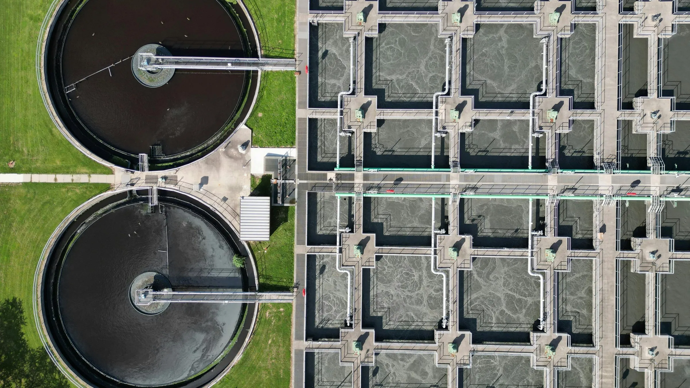 Aerial view of round clarifiers and treatment tanks at a wastewater plant