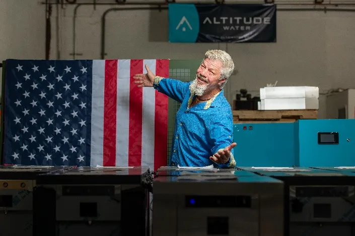 Jeff Szur, founder and CEO of Altitude Water, in the company workshop with its water generators